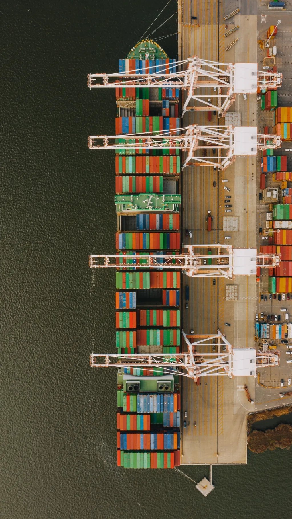 Aerial view of a cargo vessel and port infrastructure
